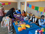 Dia de los Muertos celebration with colorful decorations and sweets